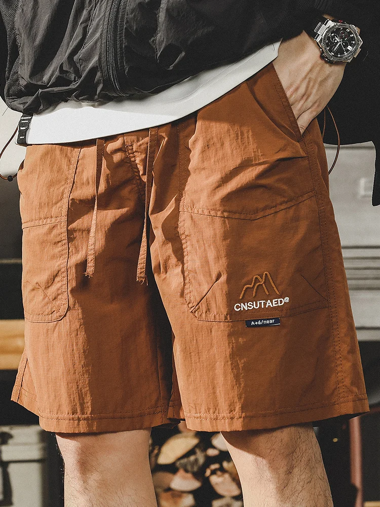 

Мужская уличная рабочая одежда серии Jieren Mountain, лето 2024, свободные американские модные брендовые брюки Qui Dry Five-Quarter