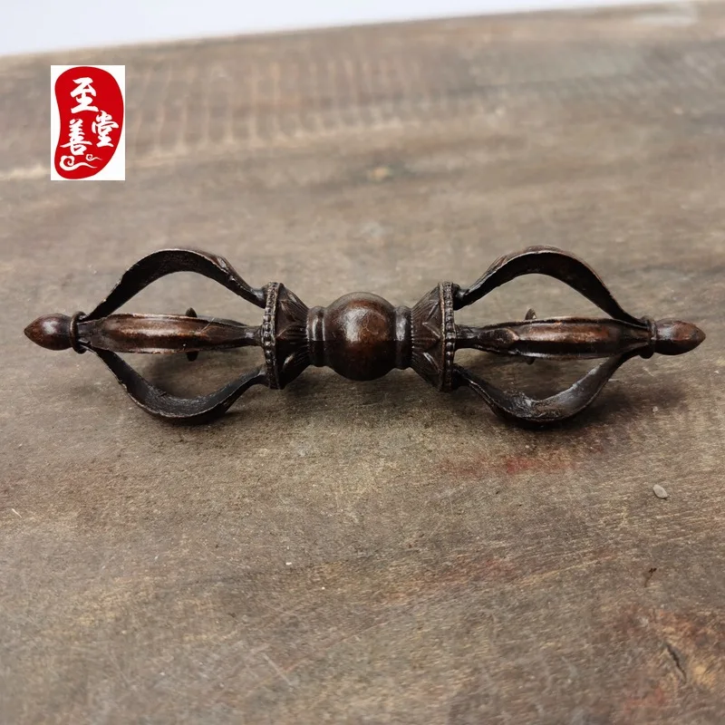 Antique-style decorative piece for the living room, featuring a replica of an old, patinated alloy bronze Vajra with five prongs