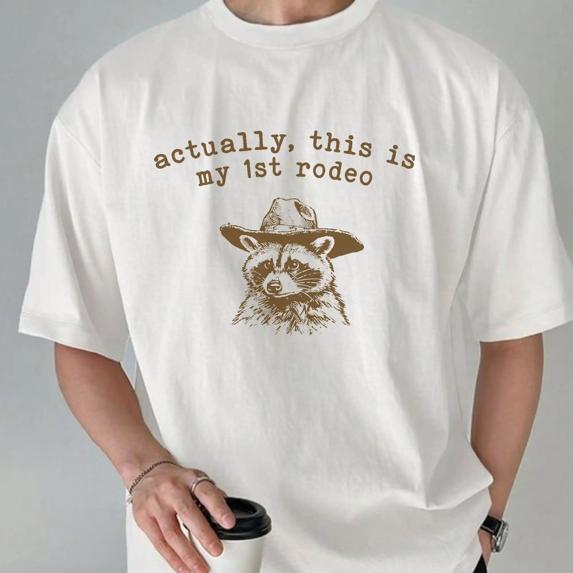 Actually This Is My First Rodeo T Shirt Funny Raccoon Sarcastic Saying Retro 90S Gag Meme Unisex