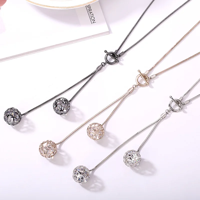 

A new fringed small ball T-buckle long necklace, a fashionable and versatile chain for women's sweaters
