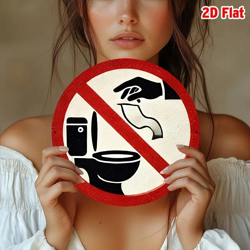 A round metal sign with the theme 'Please Do Not Throw Paper in the Toilet,' used for wall decoration in the bathroom.