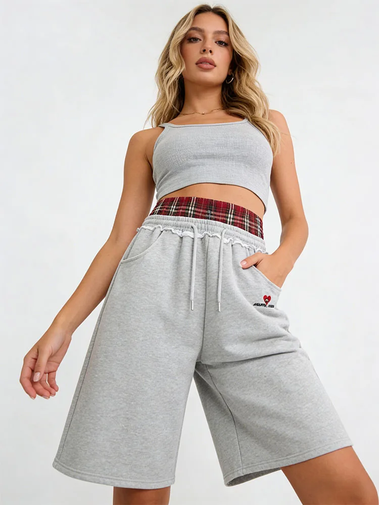 

Свободные брюки в университетском стиле с двойным поясом и имитацией шорт-трансформеров, подходящие для занятий спортом и повседневной моды.