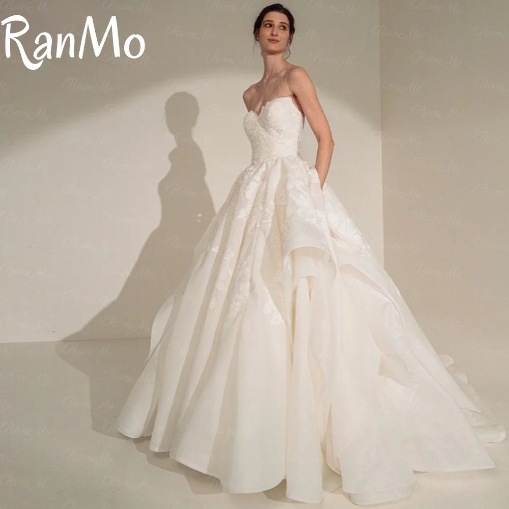 Ranmo Nuovo 2025 Bianco A Line Abito da sposa Senza maniche Fiore di pizzo Vestido de novia Elegante pavimento-lunghezza Abito da sposa Personalizzato