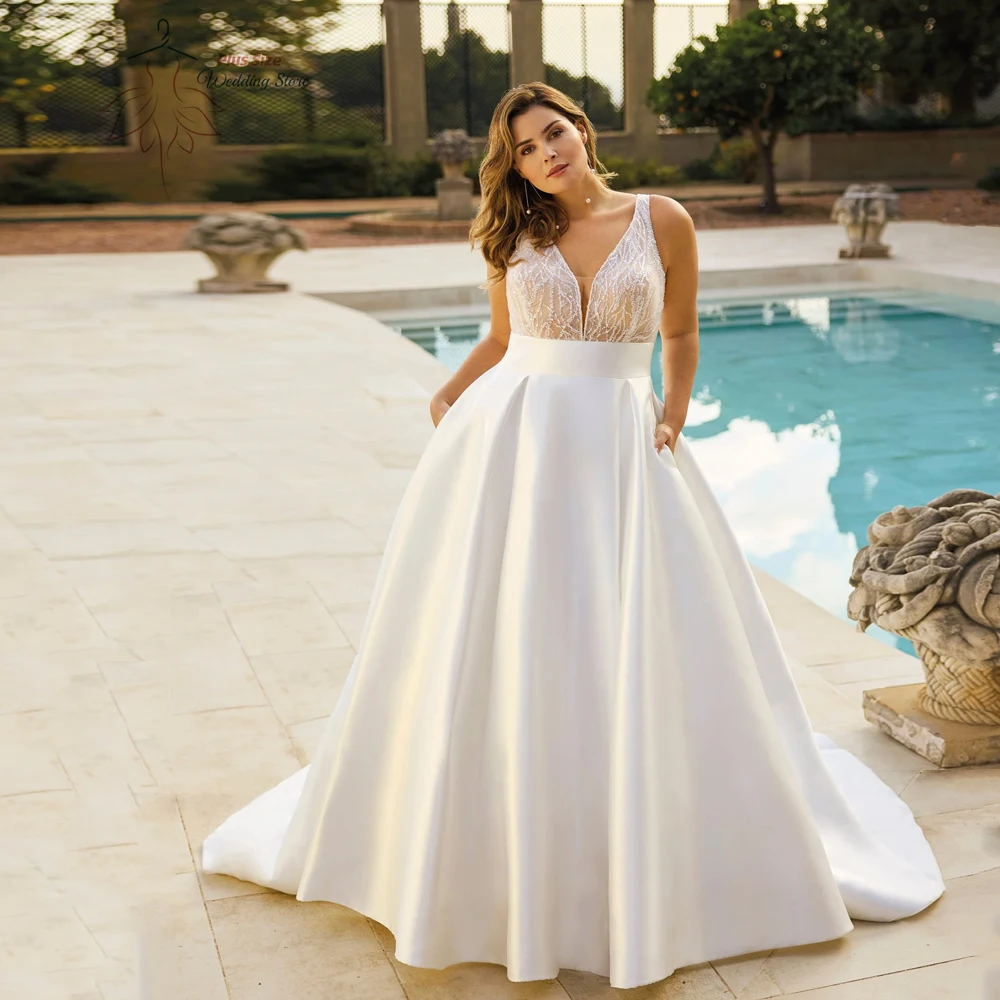 

Elegant A-Line Wedding Dresses Plus Size V Neck Sleeveless Illusion Bride Gowns Sequined Floor Length A-Line Robe De Mariee