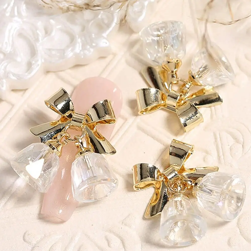 クリスマスネイルチャーム、小さなカラフルな3Dベルとリボンネイルアートデコレーション、DIYマニキュア用クリスマスネイルグリッター、ネイルアート