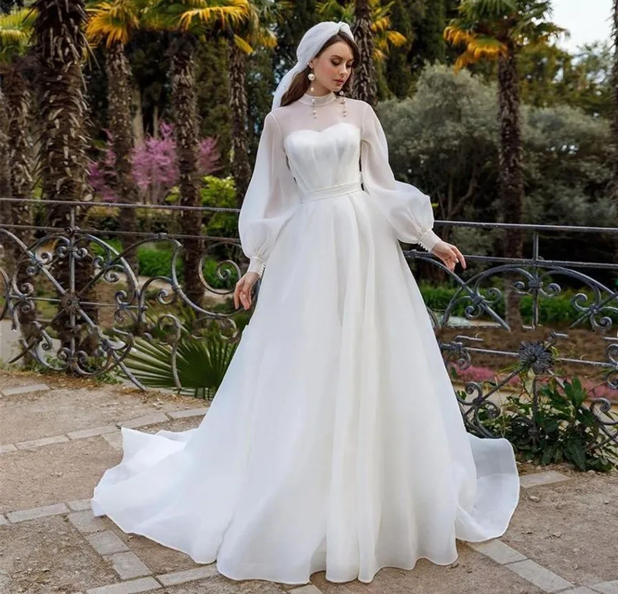 2025 A-line Abito da sposa in organza Collo ad alta illusione Maniche lunghe a sbuffo Bottoni Abiti da sposa Abiti da sposa personalizzati