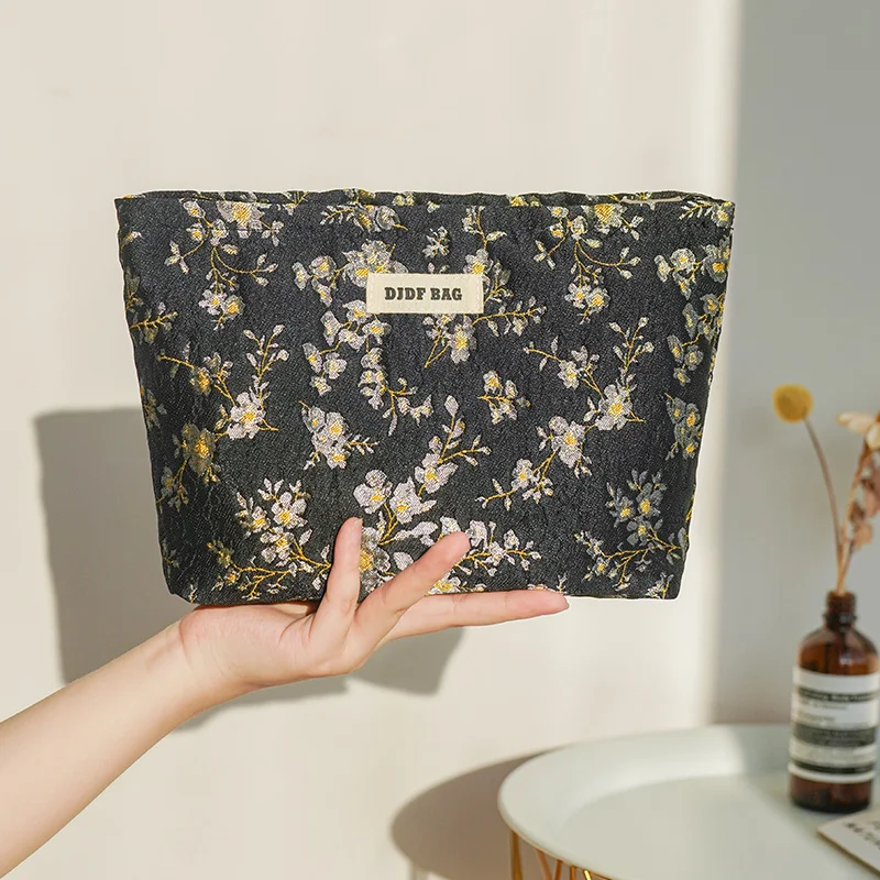 Borsa cosmetica femminile con fiore nero borsa da viaggio portatile per il cambio cosmetico di grande capacità borsa per la conservazione del