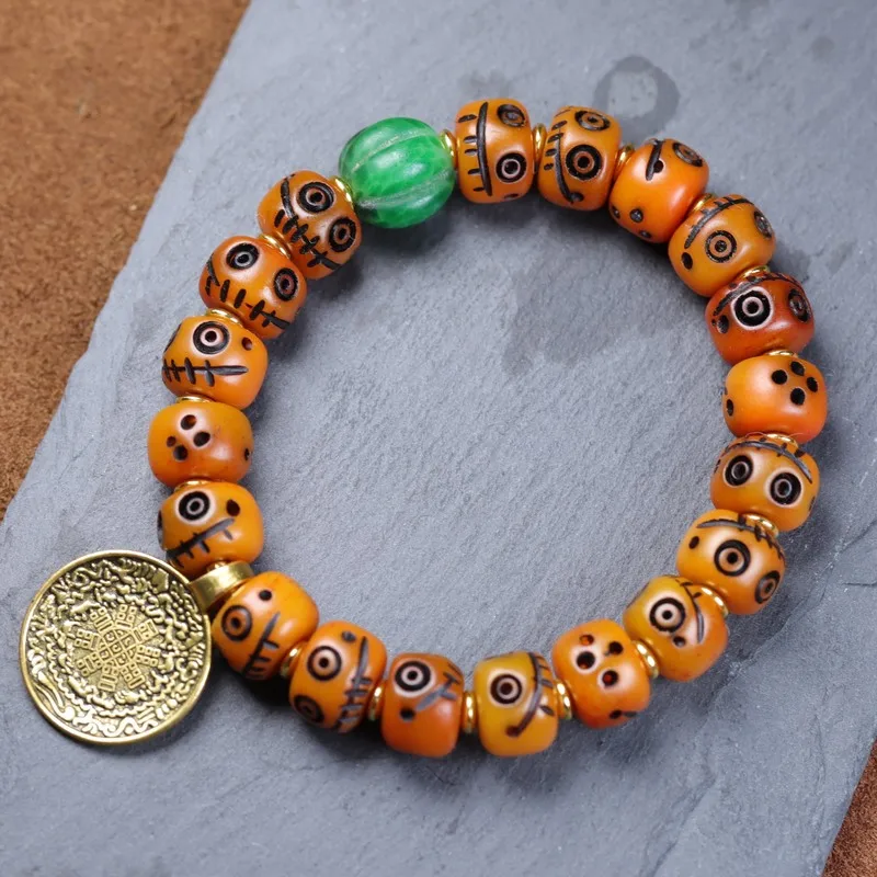 Tibetan-style yak bone carved smiling face bracelet with Huang Cai Shen pendant