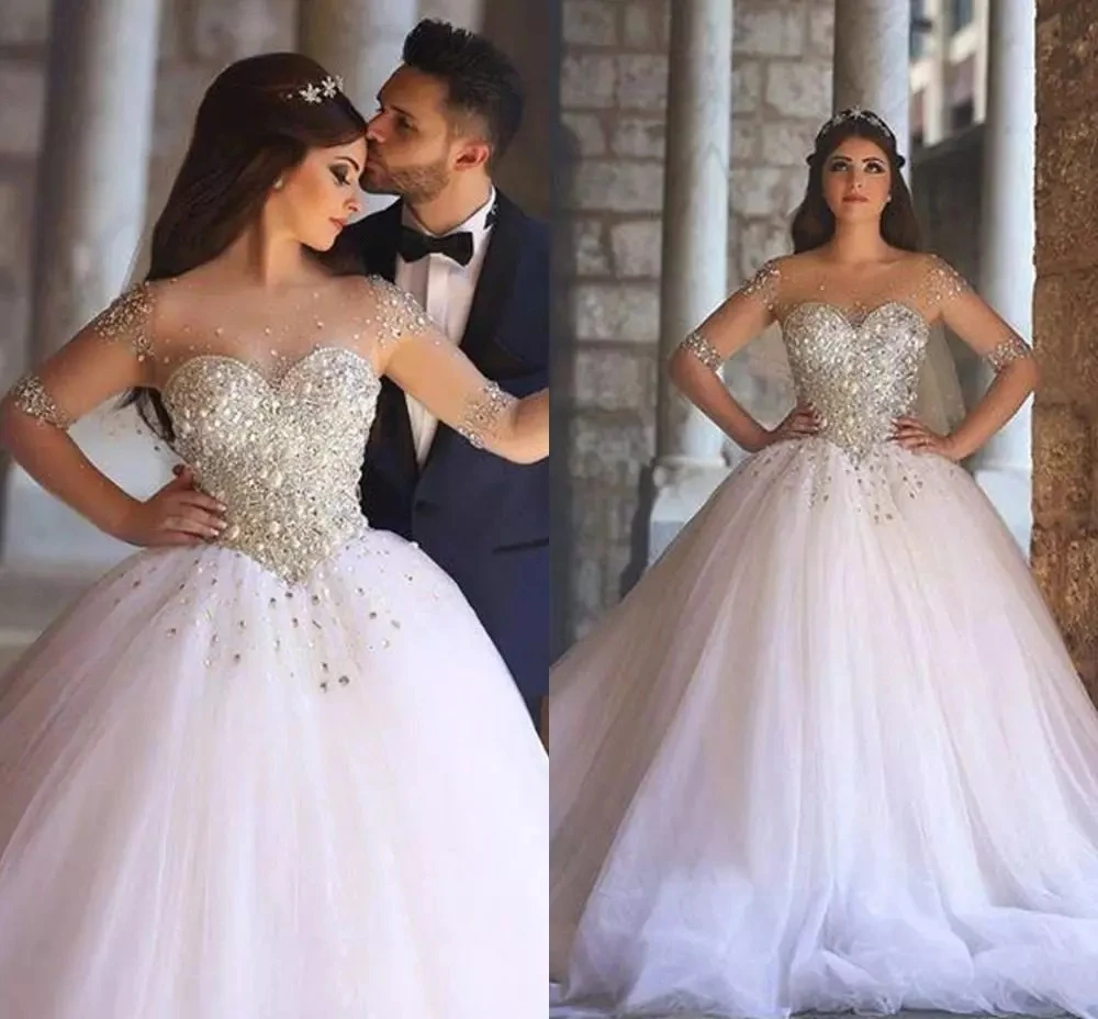 Abiti da sposa A maniche lunghe di lusso arabo Dubai una linea di abiti da sposa con perline trasparenti con scollo tondo per le donne Tulle Vestidos De Novia