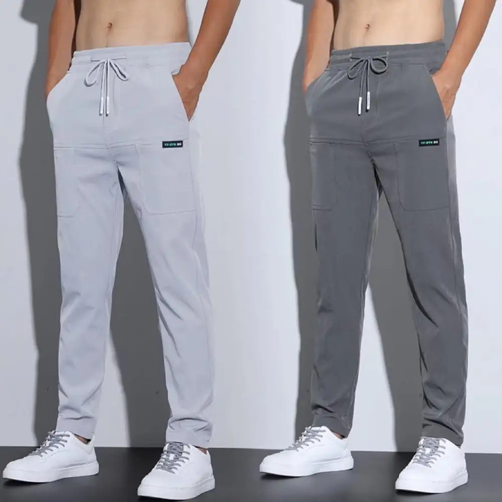 Homens sweatpants cordão multi bolsos verão cor sólida meados de cintura solta respirável perna reta calças masculinas streetwear