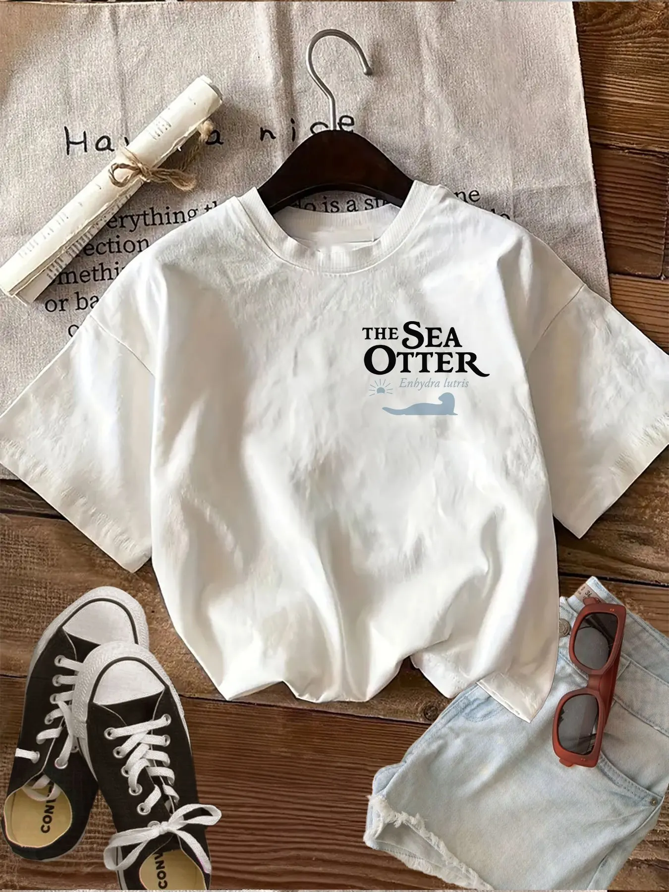 Double-Sided Printed T-Shirt Featuring A Scientific Theme with Sea Otters and Ocean Text