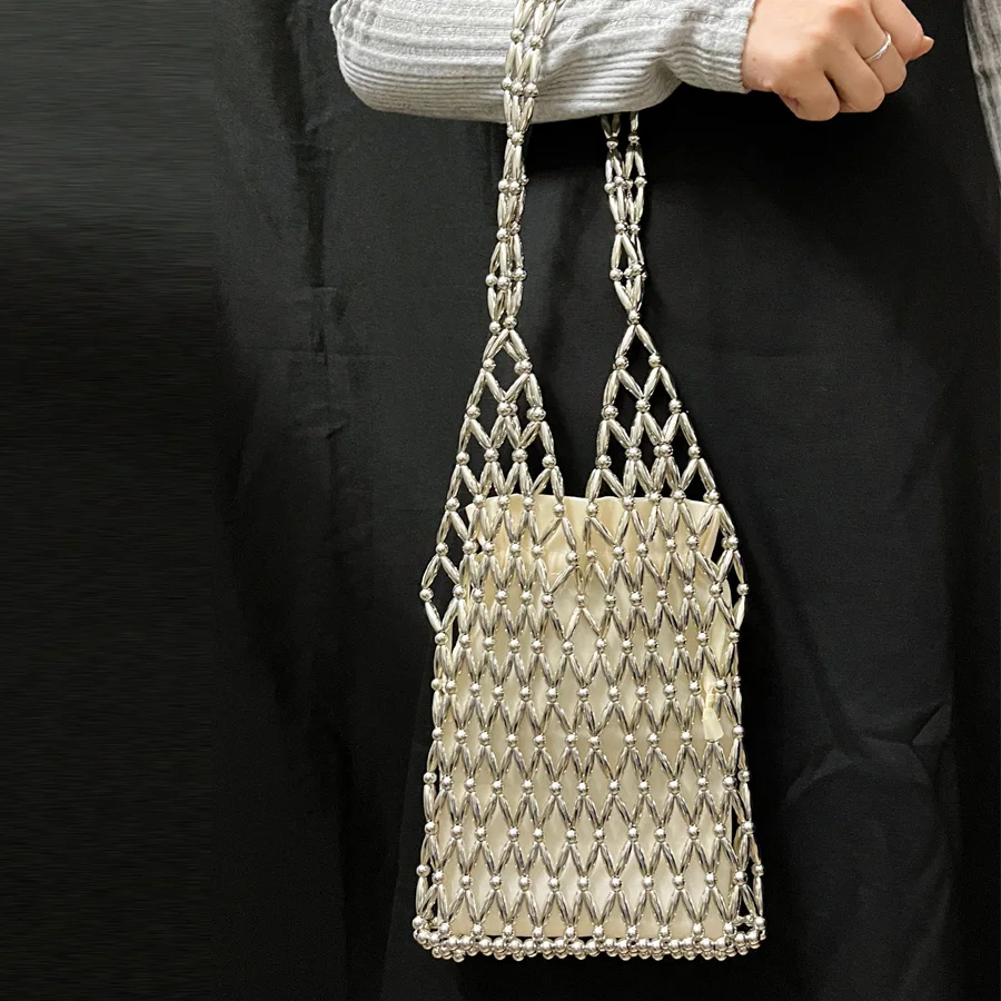 perle-d'imitazione-fatte-a-mano-scava-fuori-decorare-borse-a-secchiello-per-le-donne-borsa-e-borsetta-di-design-di-lusso-2026-nuova-spalla-di-moda