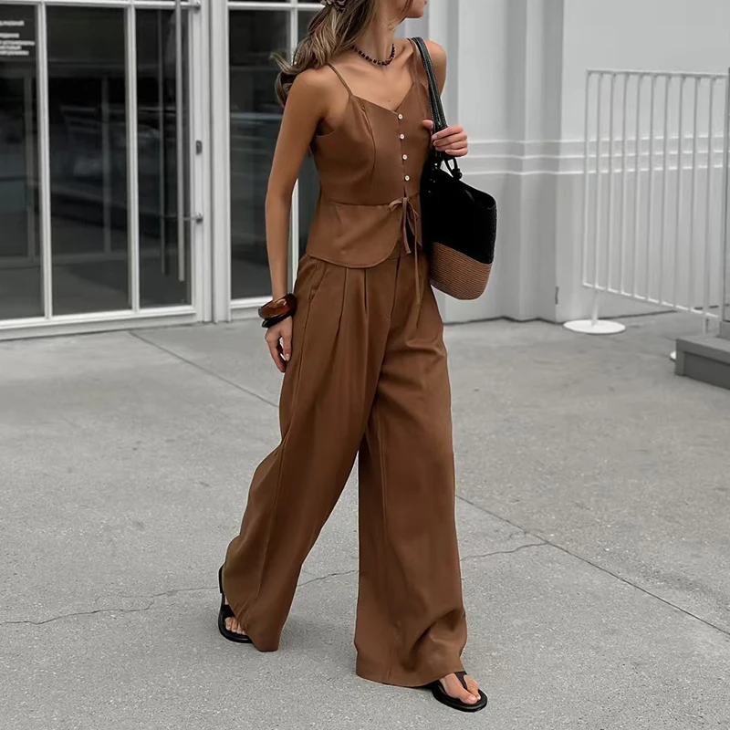 

Женский повседневный комплект из 2 предметов: модный топ без рукавов с открытыми плечами на пуговицах и шнуровке, а также широкие брюки.