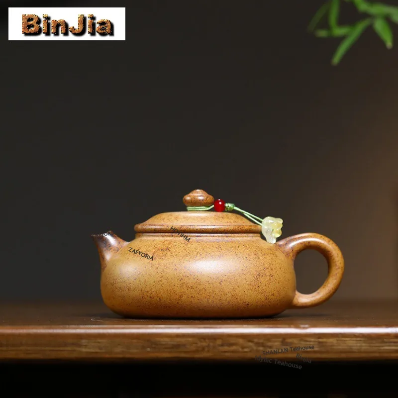 

Чайник из исинской фиолетовой глины (180 мл), ручной работы, модель Хань Цзян, из необработанной руды, обжиг на дровах, фарфоровый, с золотым песком, набор для чая из глины Цзыша