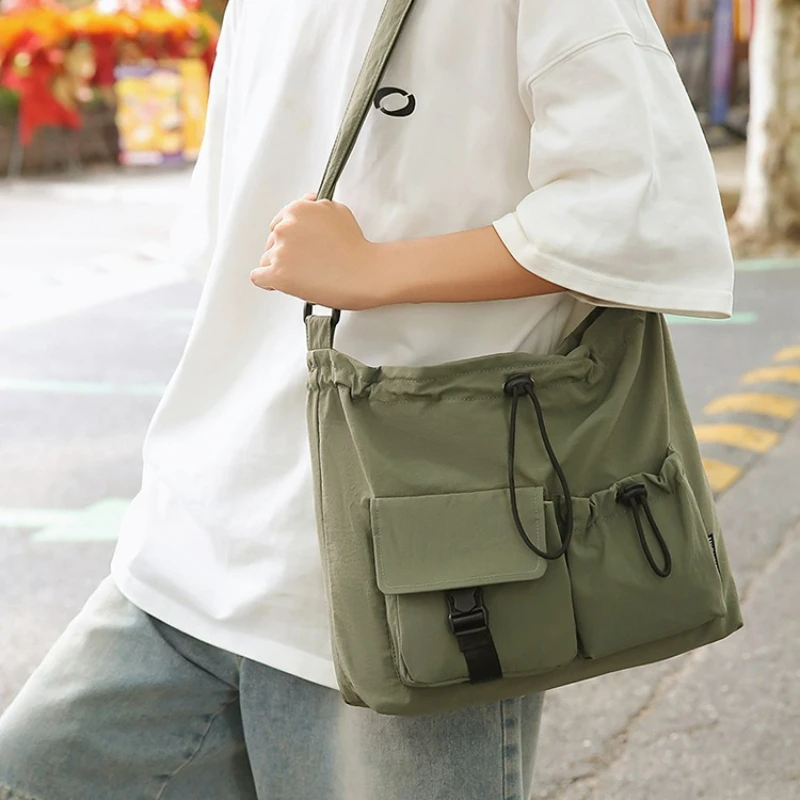 

Sporty Casual Single Shoulder Bag Korean Version of Fashionable Tote Bag with Simple Texture and Adjustable Crossbody Bag