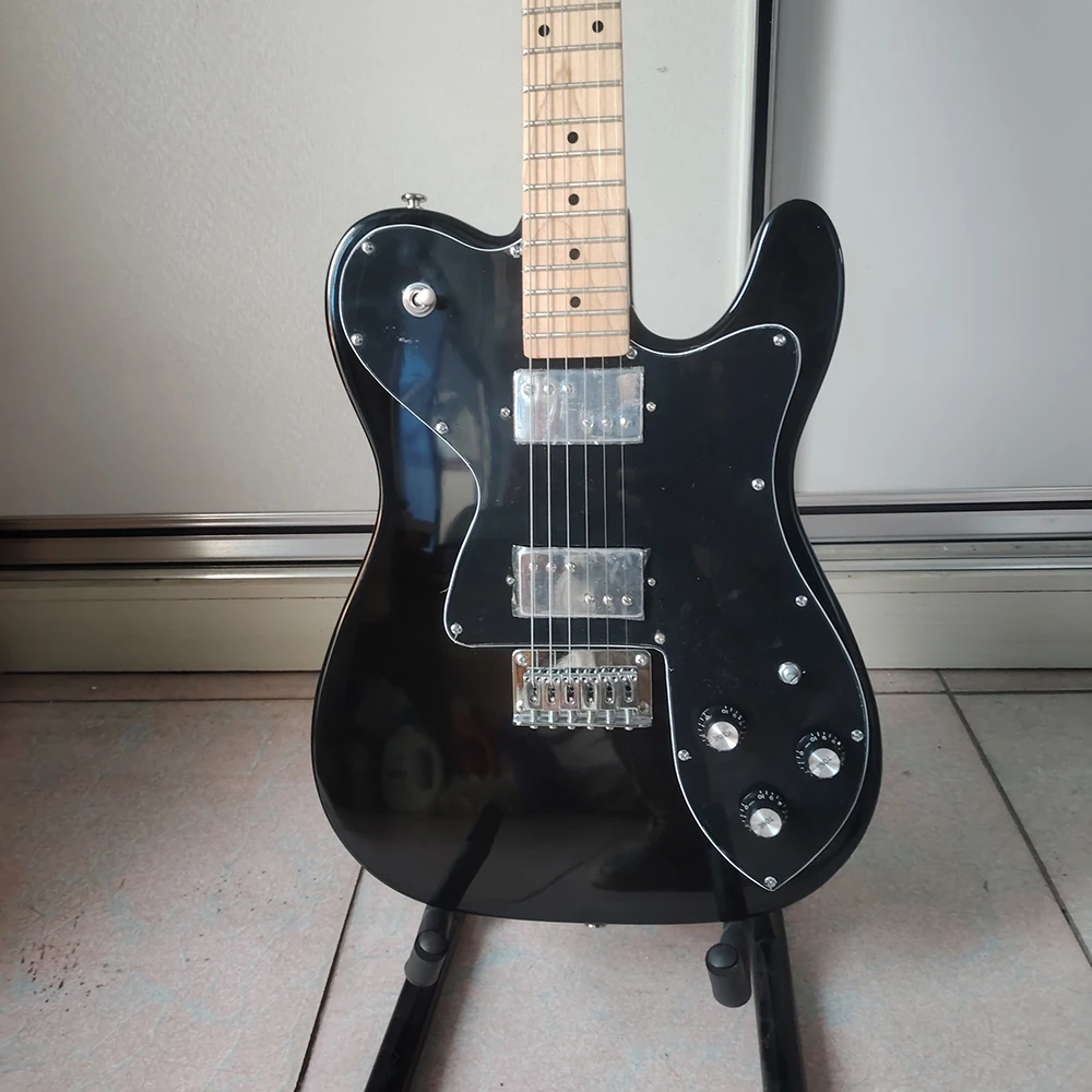 

Black TL electric guitar in stock, maple fingerboard, oversized ST head, double-sided side point LP pickup, shaped guard plate,