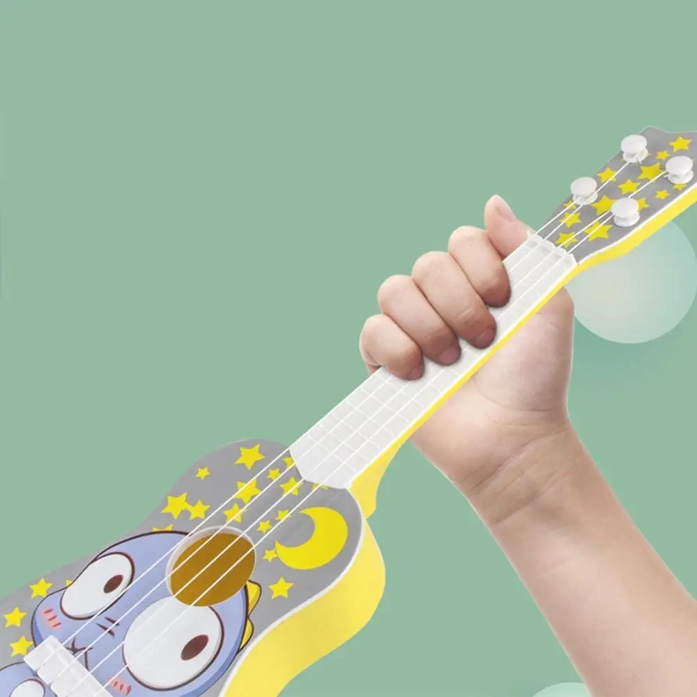 Obraz Mini grywalny plastikowy prezent urodzinowy Montessori zabawka zabawka Instrument muzyczny dla dzieci gitara dla początkujących gitara Ukulele