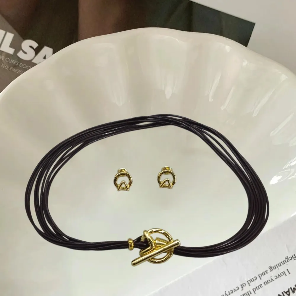 

2026 Spain Daily Leisure Style Gold Silver OT Buckle Earrings Leather Rope Necklace Jewelry Two Piece Set Holiday Gift