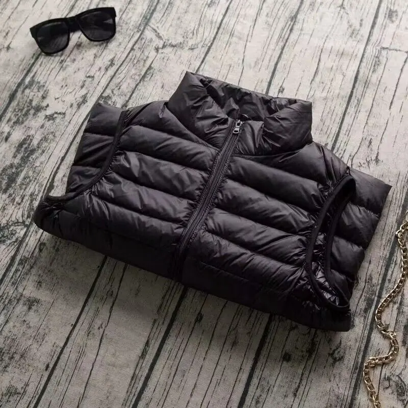 เสื้อแจ็คเก็ตพัฟเฟอร์น้ำหนักเบาสำหรับผู้หญิง ฤดูใบไม้ผลิ ฤดูใบไม้ร่วง เสื้อกั๊กขนเป็ดสีขาว อุ่นสบายสำหรับฤดูหนาว ทรงเข้ารูป ไม่มีแขน เสื้อกั๊กแบบพกพาสำหรับผู้หญิง