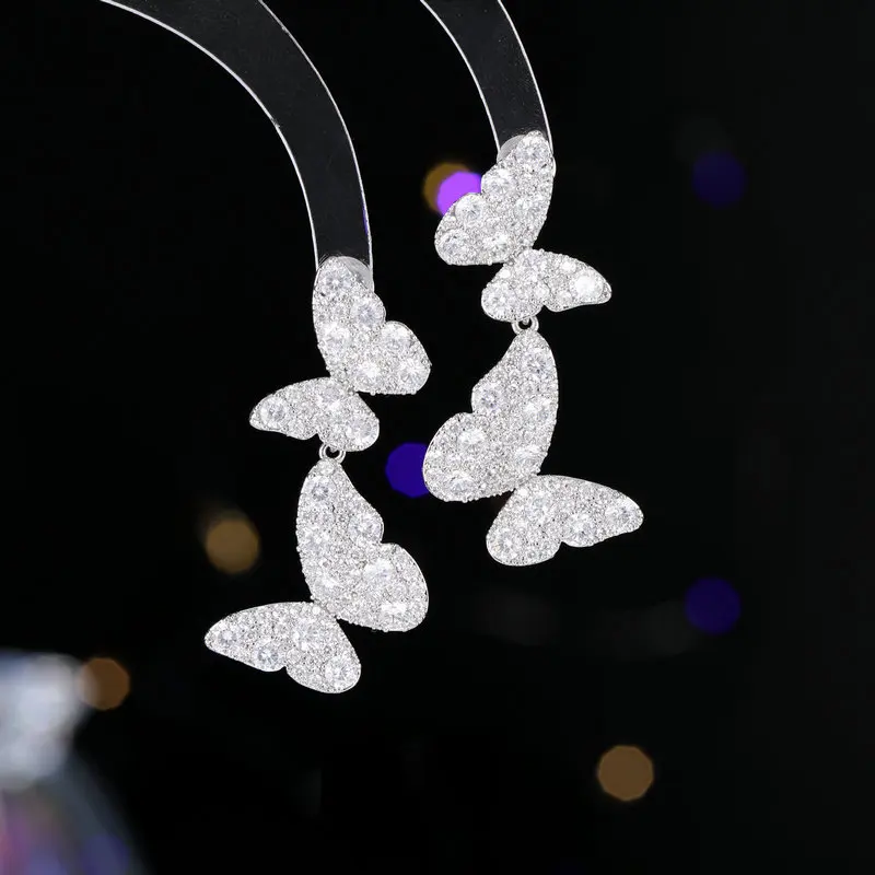 Pendientes de mariposa doble de diamante exquisito para mujer, aguja de plata 925, temperamento de lujo ligero, diseño de interés especial que combina con todo