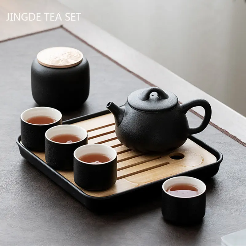 

Portable Travel Black Pottery Tea Set Chinese Ceramic Tea Pot and Cup Set A Pot of Four Cups Tea Can Customized Teaware