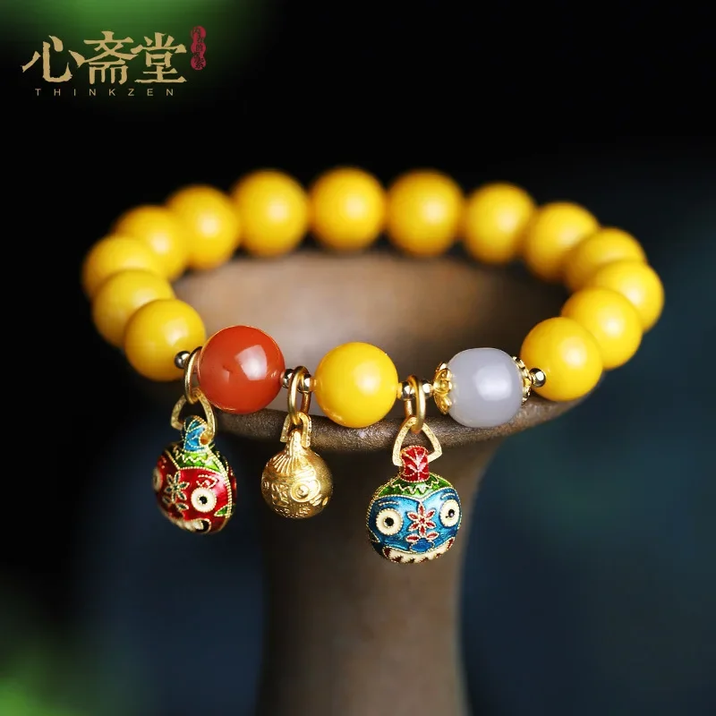 

Natural chicken oil yellow beeswax amber hand string Year of the Tiger Buddha bead bracelet men and women's accessories jewelry