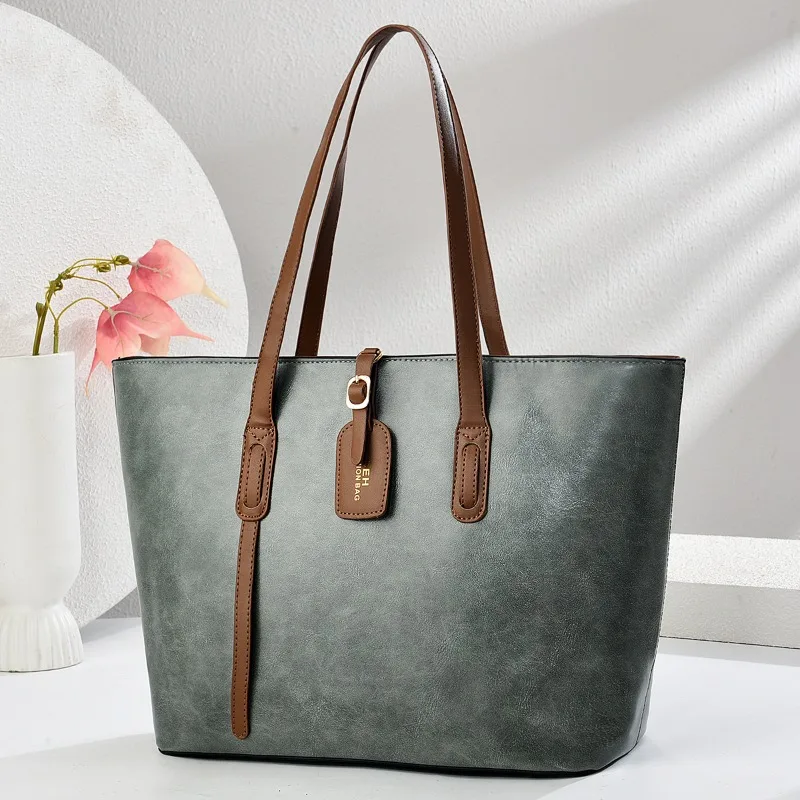 

Cowhide textured tote bag for women, single shoulder crossbody bag, stylish and practical large-capacity handbag.