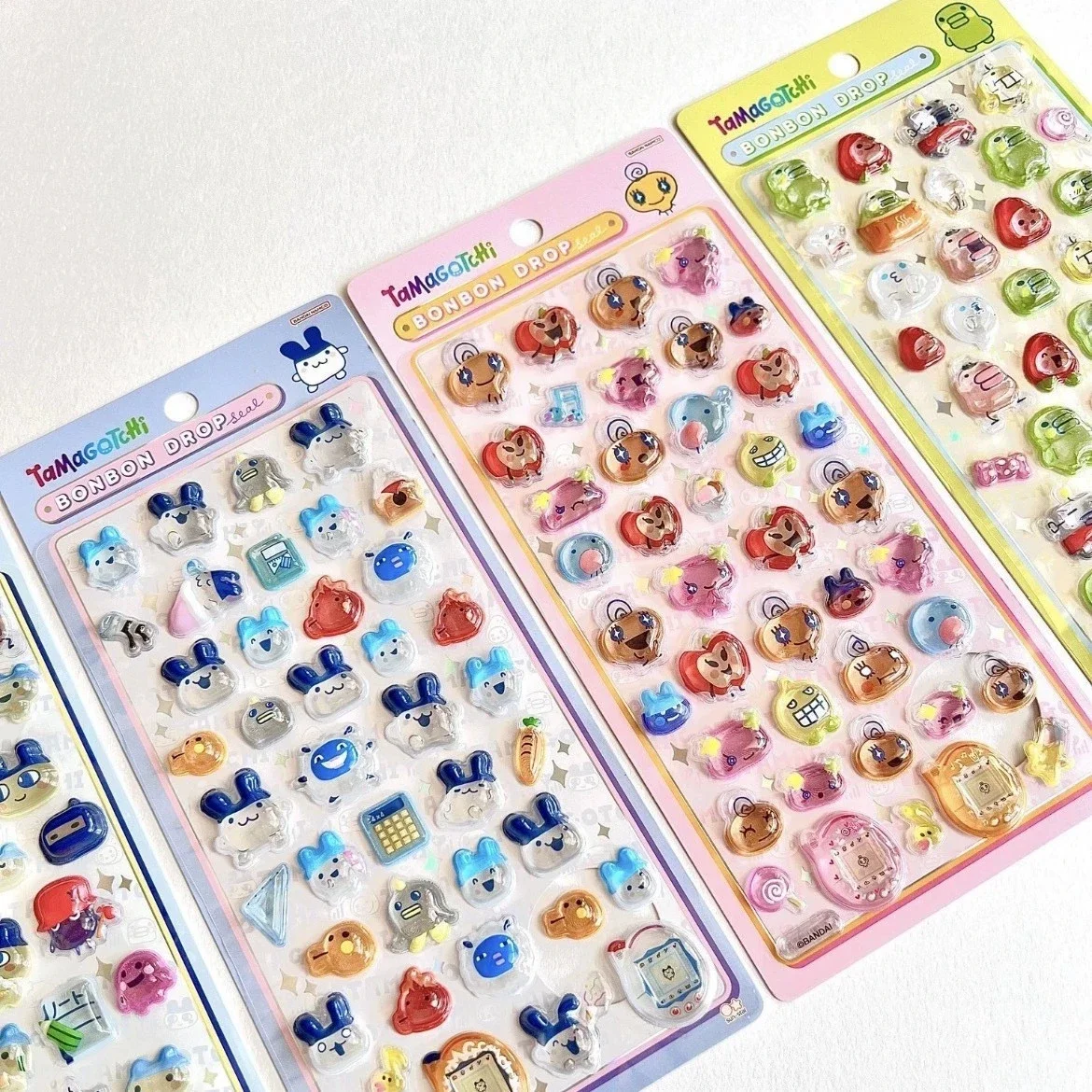 ملصقات Tamagotchii اللطيفة ثلاثية الأبعاد الإغاثة الكرتونية الطرفية جراب هاتف كاميرا شفافة كريستال حساب اليد ملصق اللعب