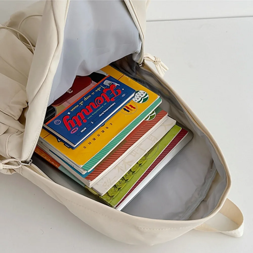 ใหม่กันน้ําเด็กโรงเรียนกระเป๋าเป้สะพายหลังไนลอนความจุขนาดใหญ่นักเรียนกระเป๋านักเรียนน้ําหนักเบากวดวิชากระเป๋าโรงเรียนสํานักงาน