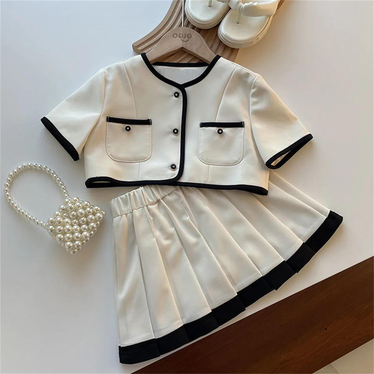 Childrens Sets Girls Summer New Solid Color Two Piece Children Clothing Short Sleeved Tops Pleated Skirt 2024 Pleated