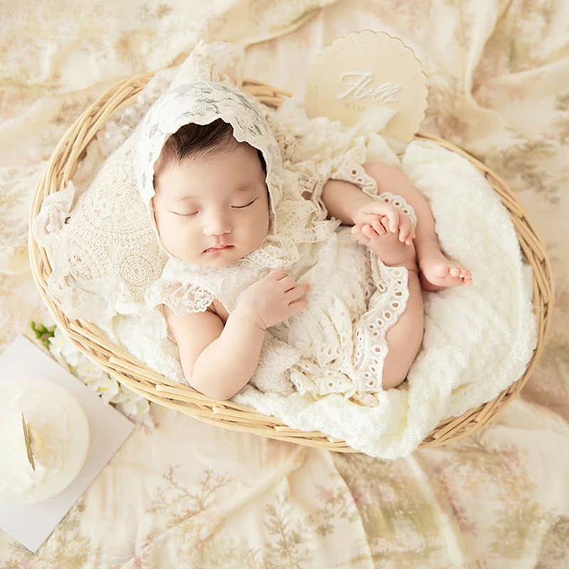 newborn-baby-girl-vintage-lace-outfit-dress-with-hat-rattan-posing-basket-pillow-floral-print-backdrop-set-for-studio-photoshoot