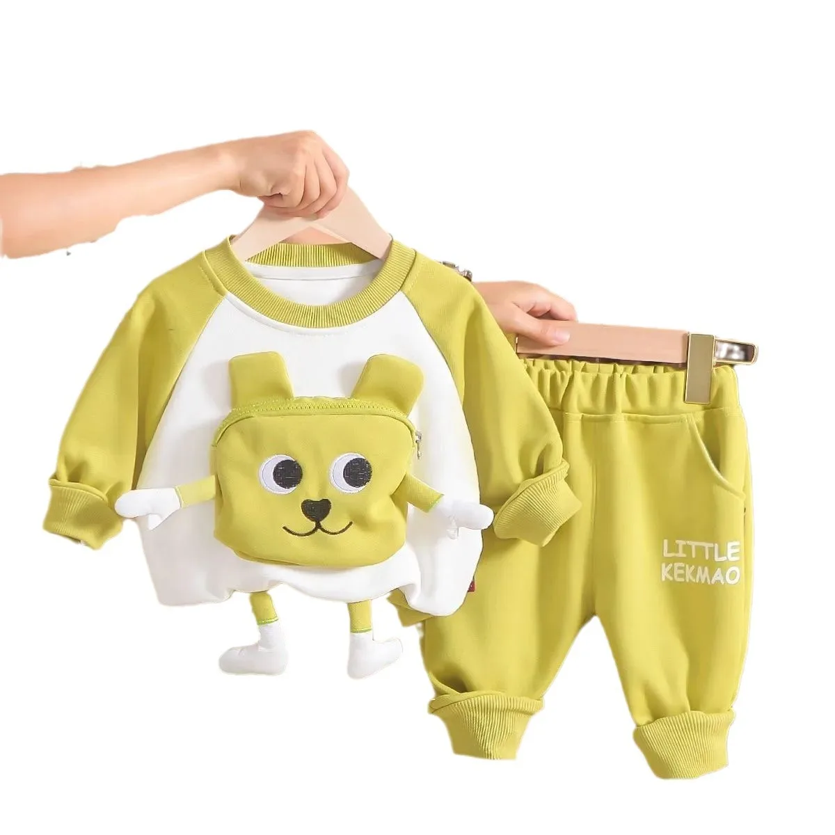 

Two piece set of long sleeved cartoon pocket hoodies, sanitary pants, and children's sportswear for boys and girls in spring and