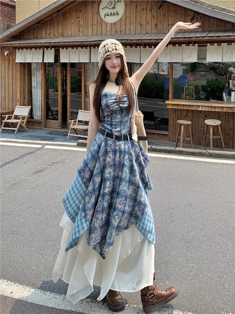 A printed halter top is layered over an irregular ruffled travel dress suit