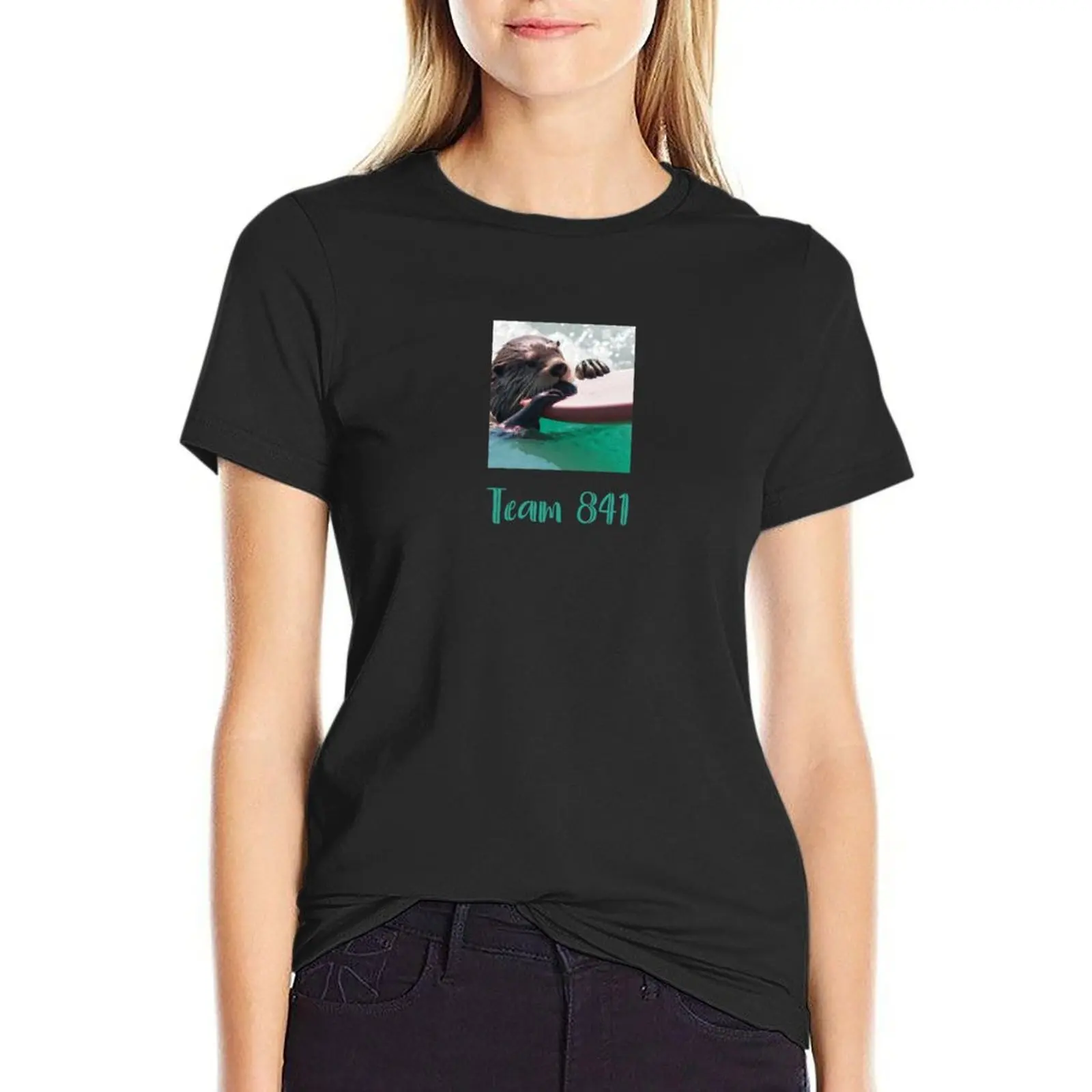 Surfing otter, team 841, ocean conservation benefit: giving back by donating 100% of the profit to organizations working T-Shirt