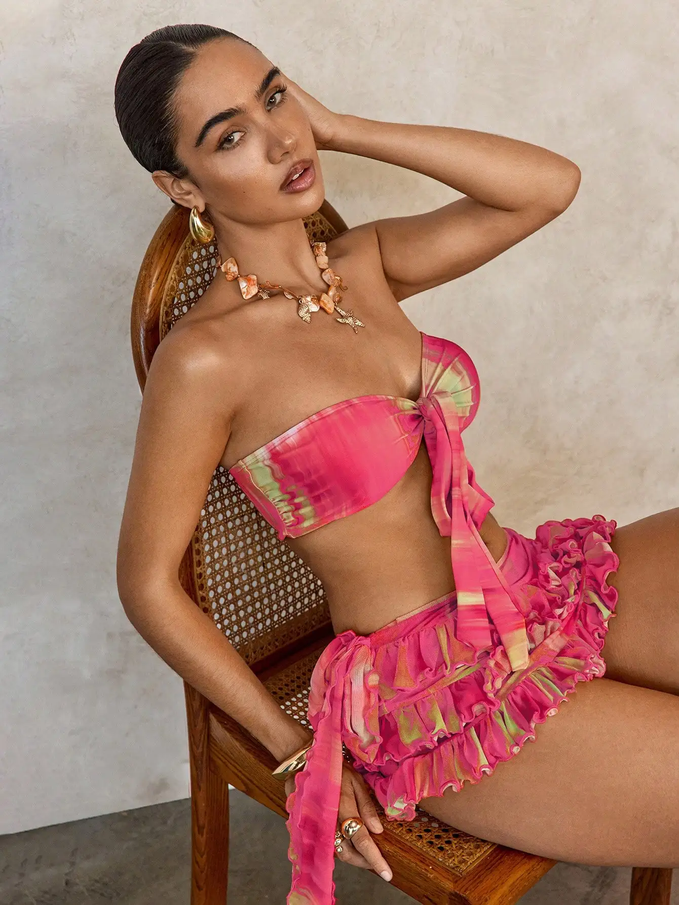 

Vibrant Tie-Dye Three-Piece Swim Set: Bandeau Top With Front Tie, Ruffled Mini Skirt, And Coordinating Sarong For Summer Resorts