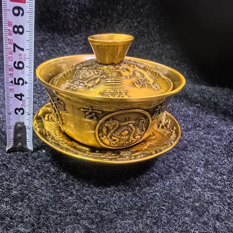 Antique-style copper relief with four auspicious animals, a three-tiered bowl, and a brass set for Kung Fu tea