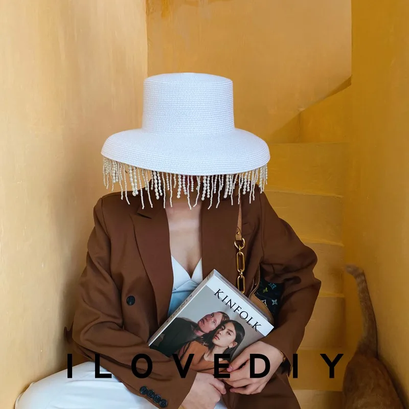 

French elegant retro Hepburn style white bell shaped hat with small fragrant pearl tassels decorated beach hat, fisherman's top