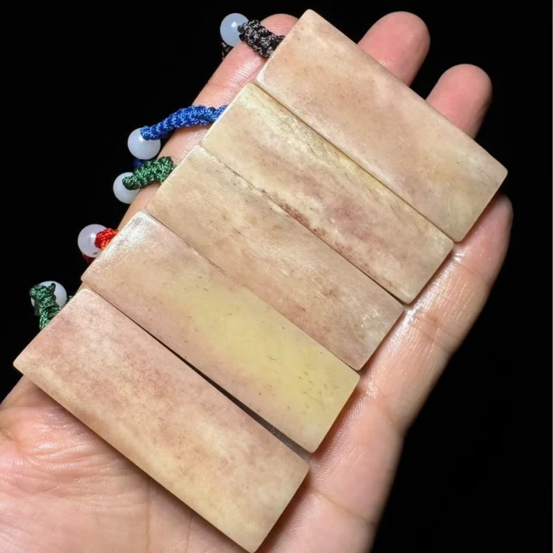 

bone pendant with small seal, full of patterns, suitable gifting or personal,