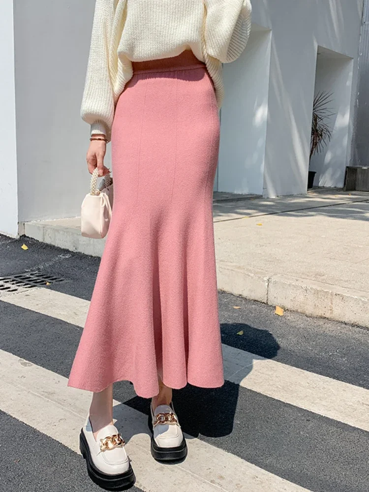 

2024 autumn and winter new Korean version solid color temperament hip-wrapped ruffle edge medium and long skirt