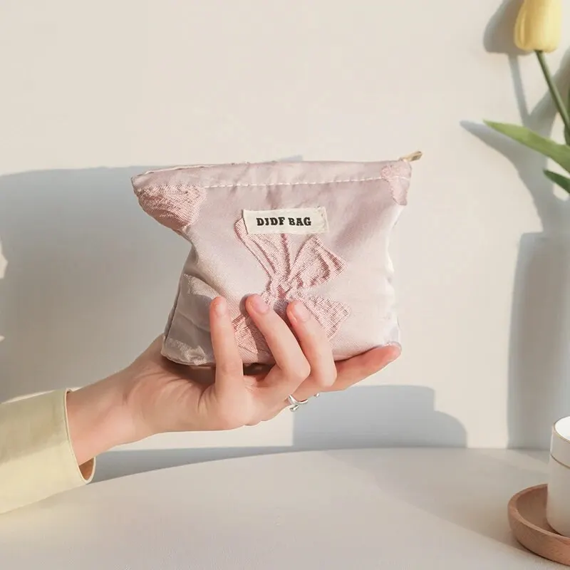 Borsa per il trucco da donna piccola borsa per il trucco del rossetto di grande capacità con fiocco rosa portamonete portatile pochette per