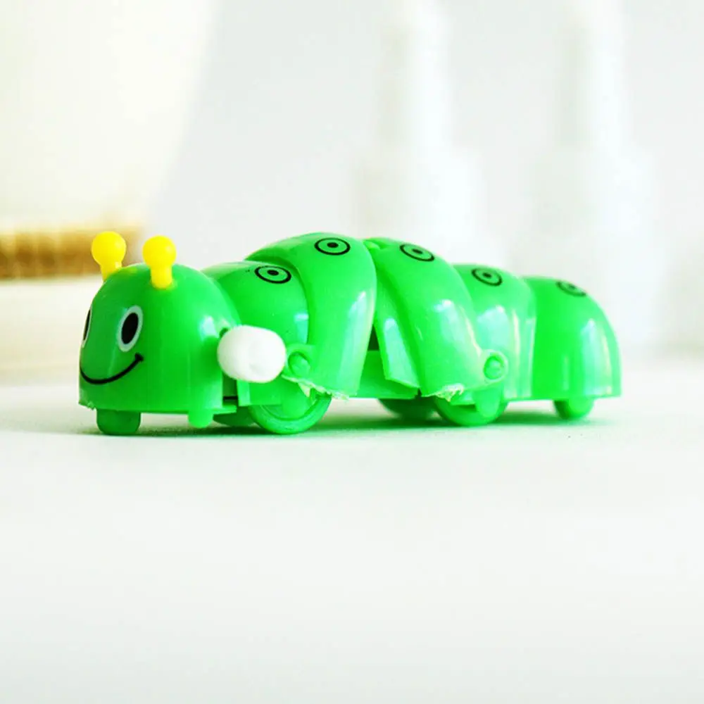 Para bebês crianças adorável engraçado plástico acabar brinquedo dos desenhos animados forma caterpillar brinquedo de relógio