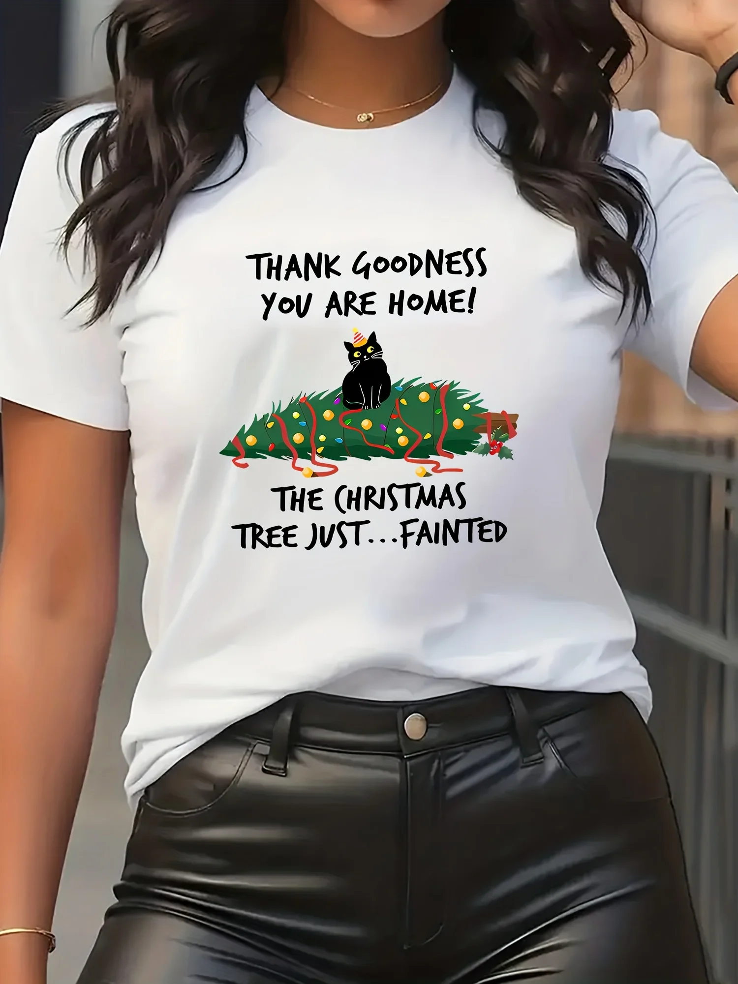 Women's Fun Christmas Cat T-shirt - Cute Black Cat with "Thank goodness you are" slogan, featuring mistletoe and Christmas tree