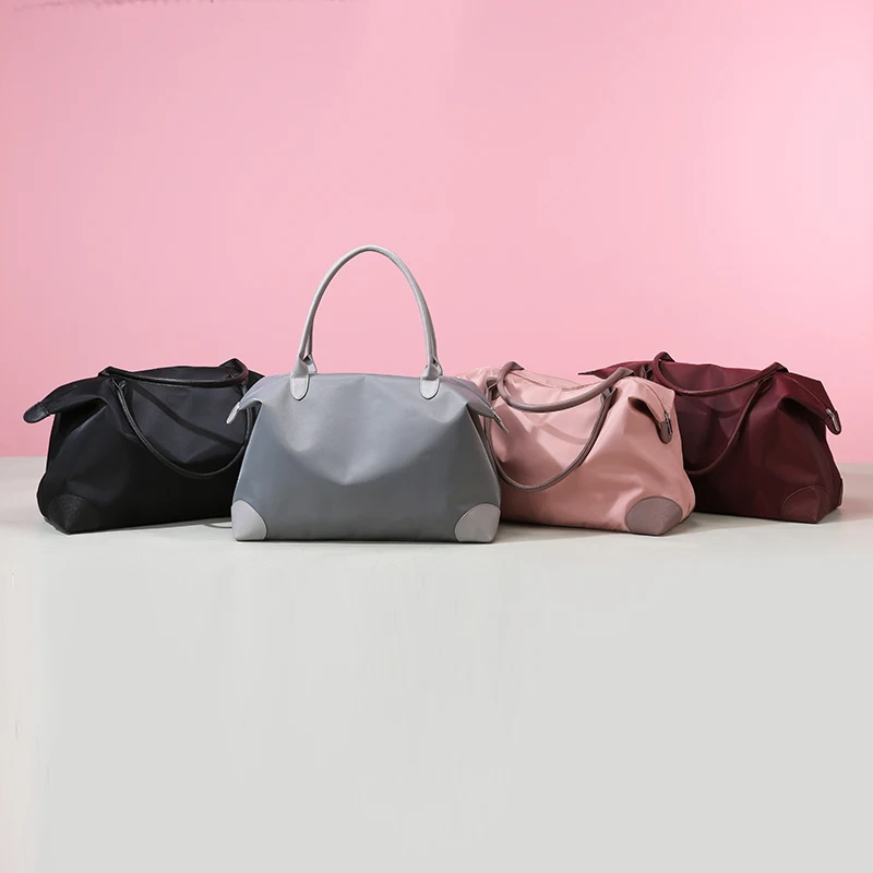 2023 Top-Marke Reisetaschen für Frauen hochwertige Nylon Handtasche Wochenend reisetasche große Kapazität wasserdichte Gepäck tasche