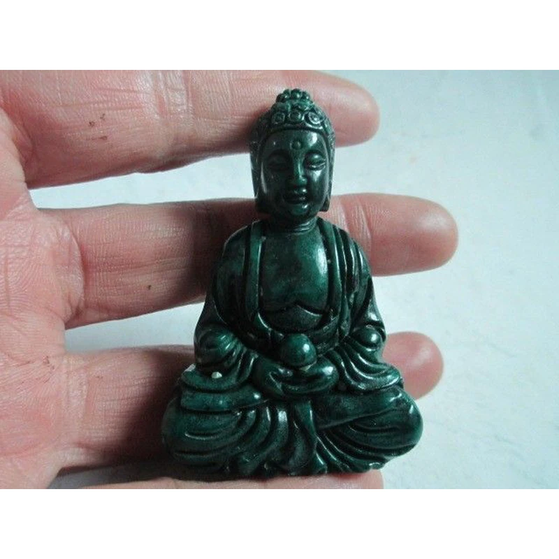 

Manual sculpture old jade in ancient China.Buddha statue