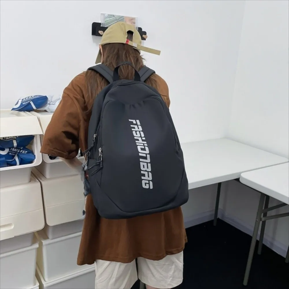 Nueva mochila escolar de gran capacidad, bolsa universitaria ligera con letras, bolsa de libros impermeable