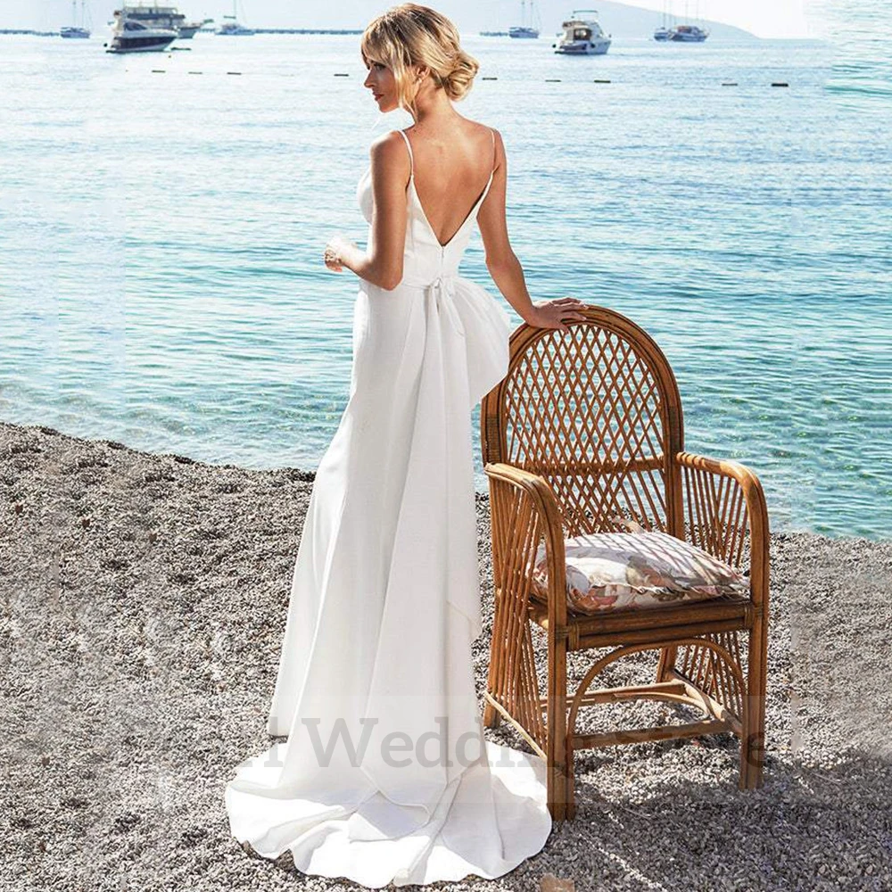 Charming Spaghetti Straps Seaside Wedding Dress Sexy Backless Mermaid Floor Length with Belt and Bow Sleeveless Bridal Gowns