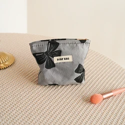 Borsa per il trucco da donna con fiocco grigio, piccola borsa da toilette portatile da viaggio, borsa per cosmetici semplice, borsa per serbatoio interno, portamonete