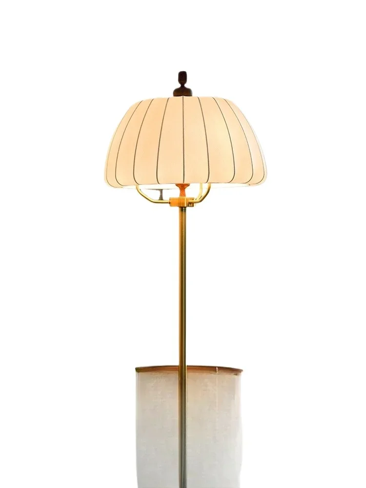 

Floor lamp, medieval retro atmosphere next to the sofa in the living room, integrated vertical decorative lamp