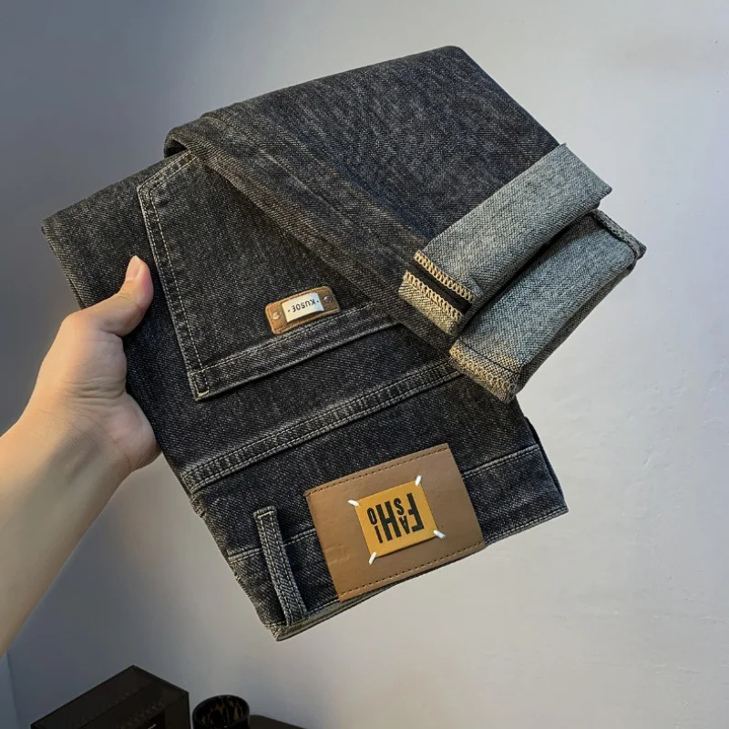 2024 Herbst schwarz grau Jeans Herren trend ige, leicht lockere, sich verjüngende Harems hose mit mittlerer Taille und bedruckter, bequemer Stretch hose