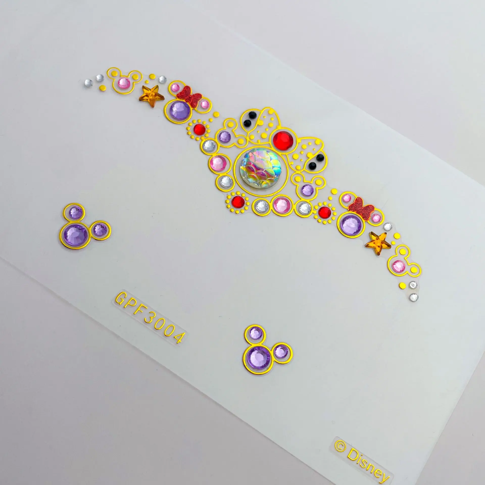 ملصقات وجه مجوهرات ذاتية الصنع الأكثر مبيعًا من Miniso Disney ملصقات ماسية من الأكريليك ملصقات فنية لتزيين الحواجب في 1 يونيو